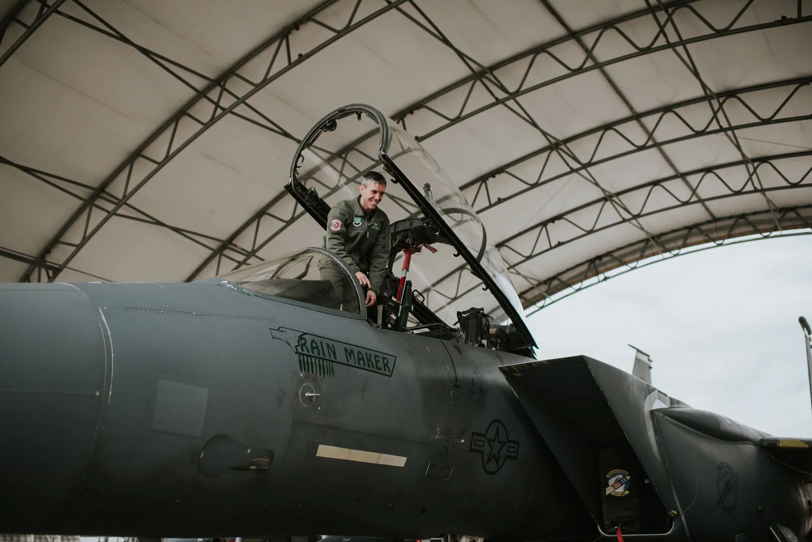 Hoover climbing into an F-15E cockpit